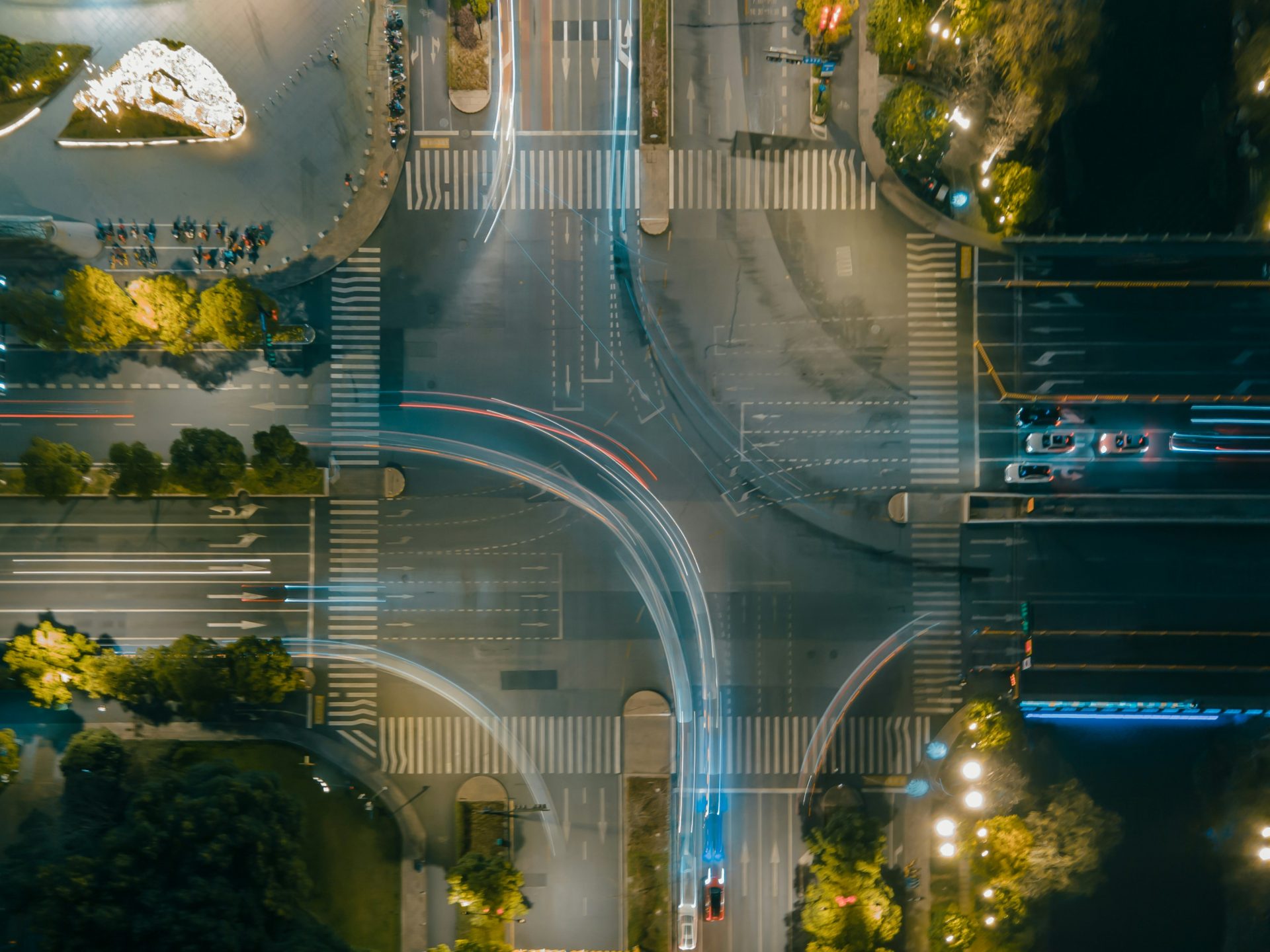 an aerial view of a city intersection at night